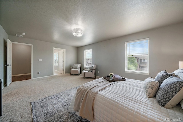 1181 W 170th Ave, Broomfield, CO 80023 - carpeted bedroom with multiple windows, baseboards, and a textured ceiling