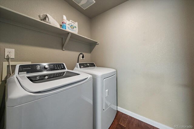 1181 W 170th Ave, Broomfield, CO 80023 - washroom with washer and clothes dryer, dark wood-style floors, and baseboards