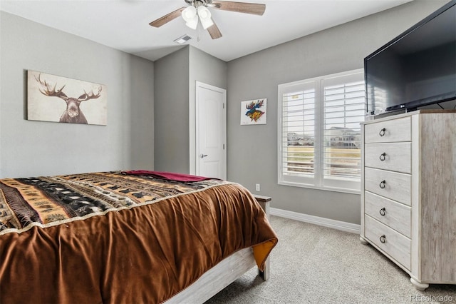 bedroom with ceiling fan, baseboards, light colored carpet, and visible vents