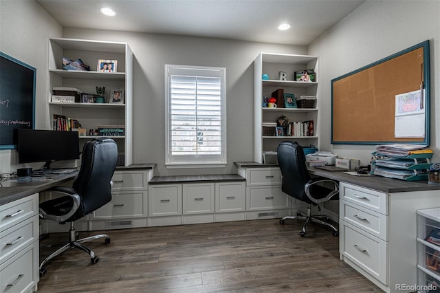 office with built in study area, dark wood-style flooring, and recessed lighting