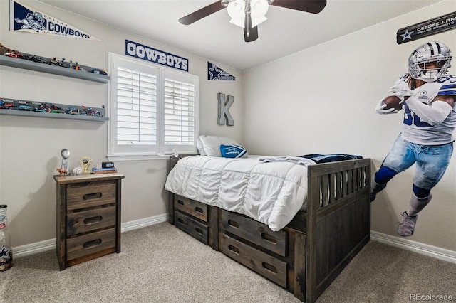 bedroom with baseboards, carpet, and a ceiling fan