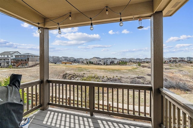 wooden deck featuring a residential view