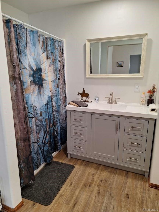 bathroom featuring vanity and hardwood / wood-style flooring