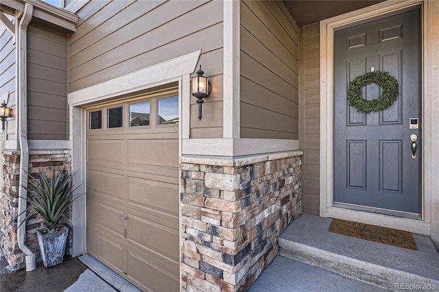 entrance to property featuring a garage