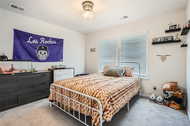 bedroom with carpet flooring and visible vents