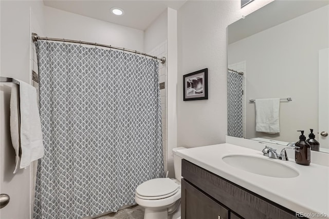 full bathroom with vanity and toilet