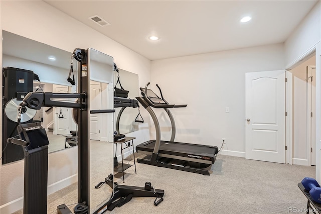 exercise area featuring baseboards, recessed lighting, visible vents, and light colored carpet