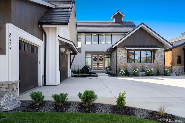 view of front of home featuring a garage and french doors