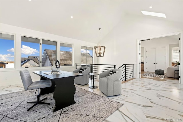 dining room featuring high vaulted ceiling and a chandelier