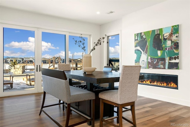 dining area featuring dark wood-type flooring