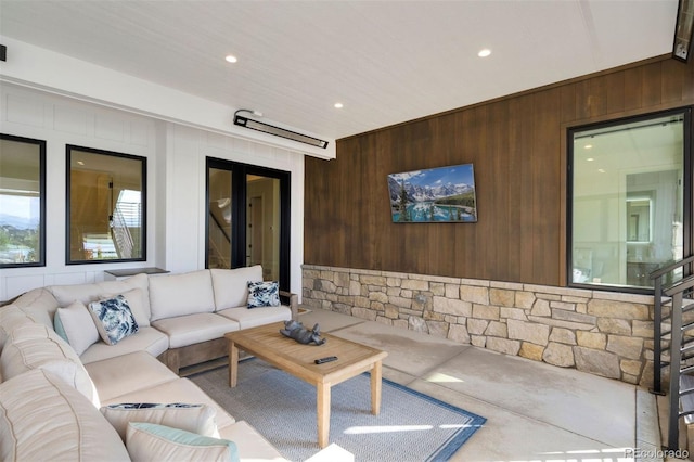 living room with wood walls