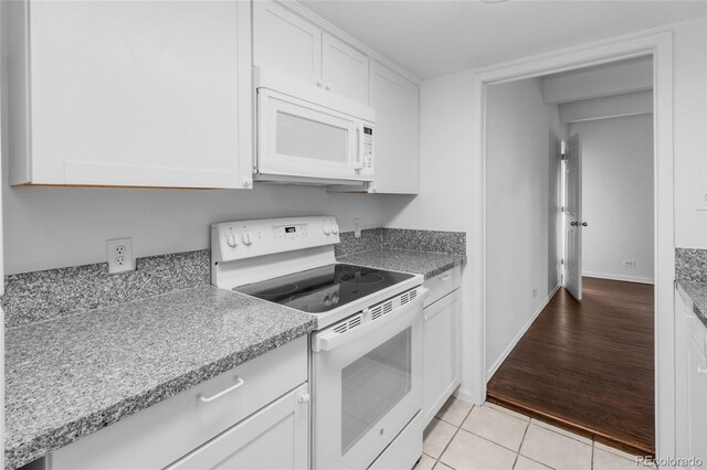 kitchen featuring light hardwood / wood-style floors, white cabinetry, and white appliances