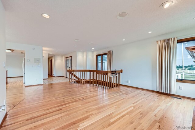 16710 Vincent Ave, Monument, CO 80132 - empty room with wood finished floors and recessed lighting