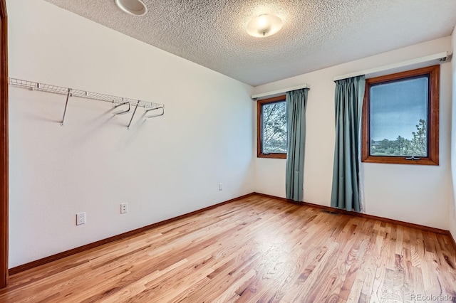 16710 Vincent Ave, Monument, CO 80132 - unfurnished room featuring a textured ceiling and light wood-style flooring