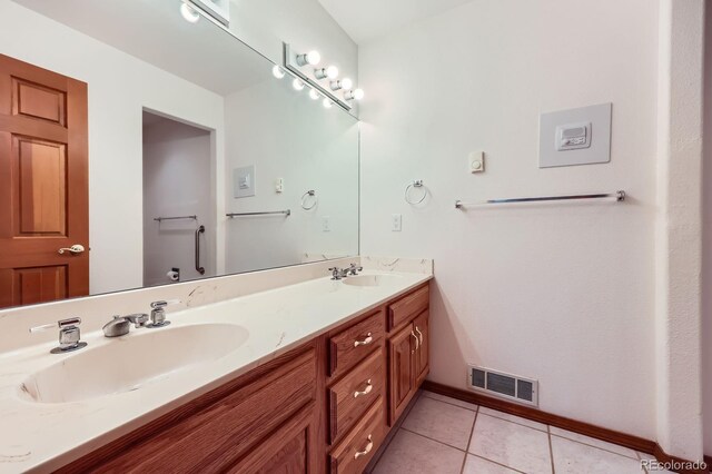 16710 Vincent Ave, Monument, CO 80132 - bathroom with double vanity and tile patterned floors