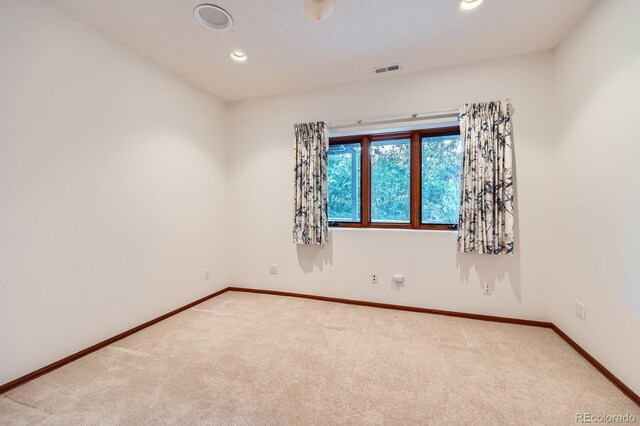 16710 Vincent Ave, Monument, CO 80132 - carpeted spare room with baseboards and recessed lighting