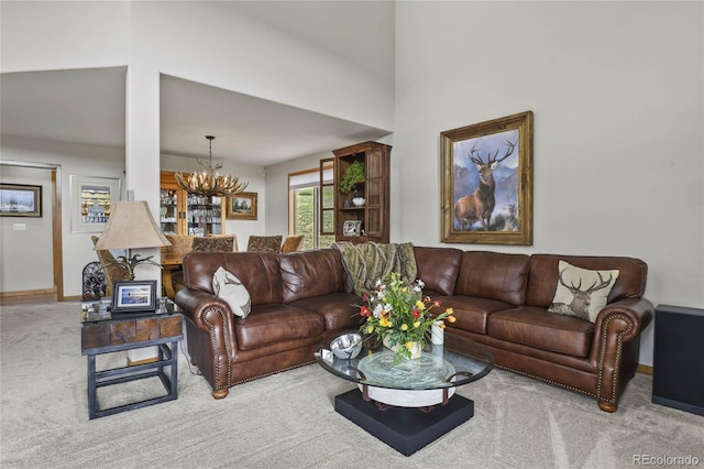 living room with carpet floors and a notable chandelier