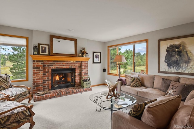 carpeted living room with plenty of natural light and a fireplace