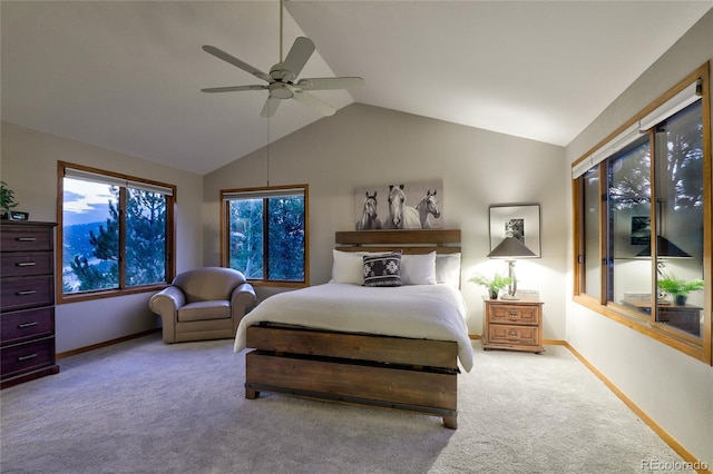 carpeted bedroom featuring lofted ceiling and ceiling fan