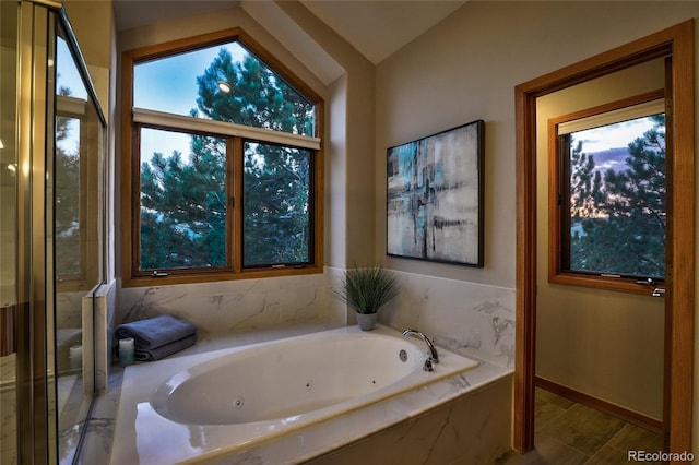 bathroom with tiled tub