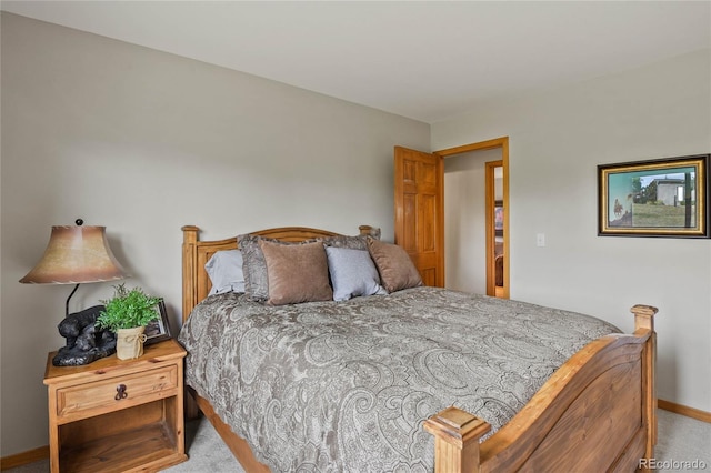 bedroom featuring light carpet