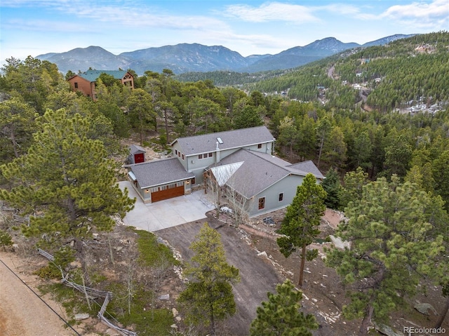1055 Divide View Dr, Golden, CO 80403 - aerial view featuring a view of trees and a mountain view