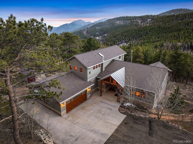 1055 Divide View Dr, Golden, CO 80403 - birds eye view of property featuring a view of trees and a mountain view