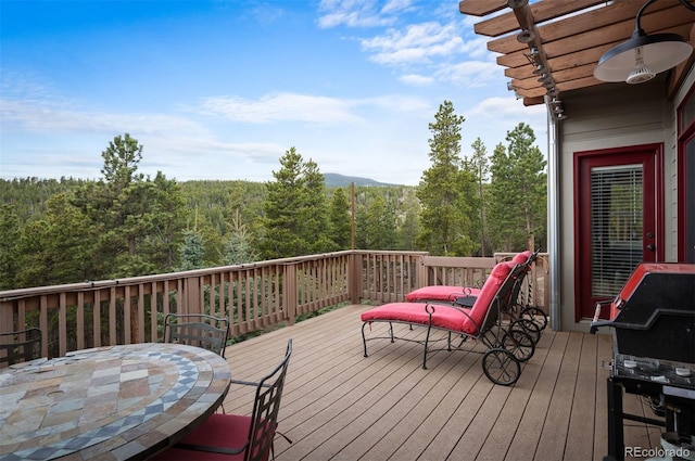 1055 Divide View Dr, Golden, CO 80403 - wooden deck with a view of trees and area for grilling