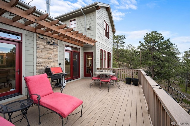 1055 Divide View Dr, Golden, CO 80403 - wooden deck with a pergola, outdoor dining area, and a grill