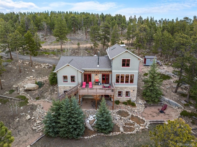 1055 Divide View Dr, Golden, CO 80403 - rear view of property with a deck, stairs, and stone siding