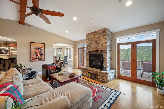 1055 Divide View Dr, Golden, CO 80403 - living room with visible vents, a wealth of natural light, wood finished floors, and lofted ceiling
