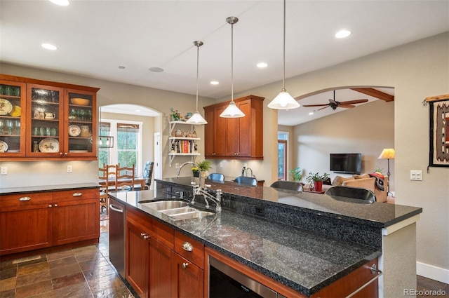 1055 Divide View Dr, Golden, CO 80403 - kitchen with wine cooler, ceiling fan, recessed lighting, arched walkways, and a sink