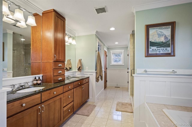 1055 Divide View Dr, Golden, CO 80403 - full bath featuring double vanity, ornamental molding, a sink, and a stall shower