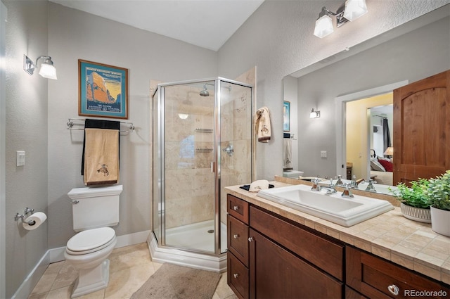 1055 Divide View Dr, Golden, CO 80403 - bathroom with baseboards, tile patterned floors, toilet, and a shower stall