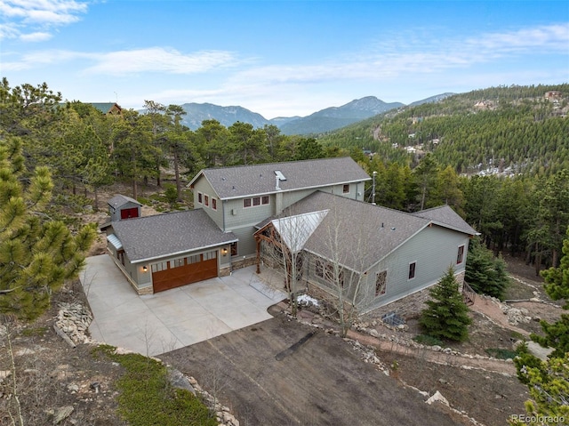 1055 Divide View Dr, Golden, CO 80403 - drone / aerial view featuring a forest view and a mountain view