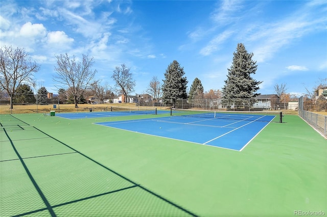 view of sport court with fence