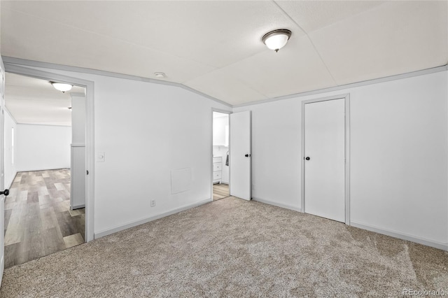 120 Pinon Dr, Hotchkiss, CO 81419 - unfurnished bedroom featuring vaulted ceiling and carpet flooring