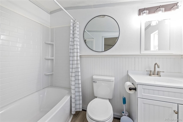 120 Pinon Dr, Hotchkiss, CO 81419 - full bath with shower / bath combo, vanity, wainscoting, and wood finished floors
