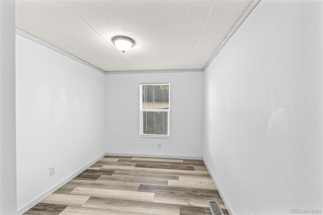 120 Pinon Dr, Hotchkiss, CO 81419 - spare room with a textured ceiling and wood finished floors