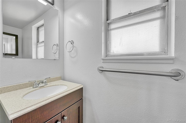 bathroom with vanity and plenty of natural light