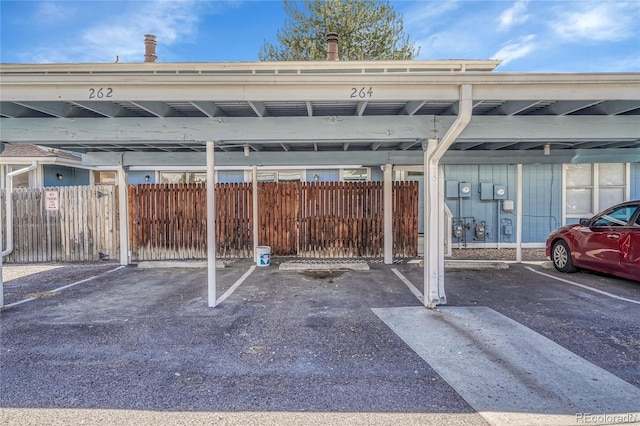 covered parking lot with fence