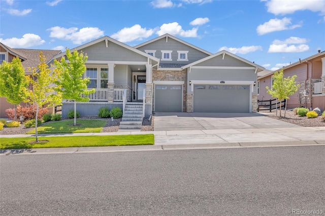 8772 S Sicily Ct, Aurora, CO 80016 - craftsman inspired home with covered porch, concrete driveway, stone siding, a front lawn, and a garage