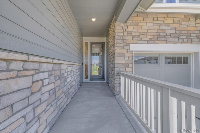 8772 S Sicily Ct, Aurora, CO 80016 - doorway to property featuring stone siding and an attached garage