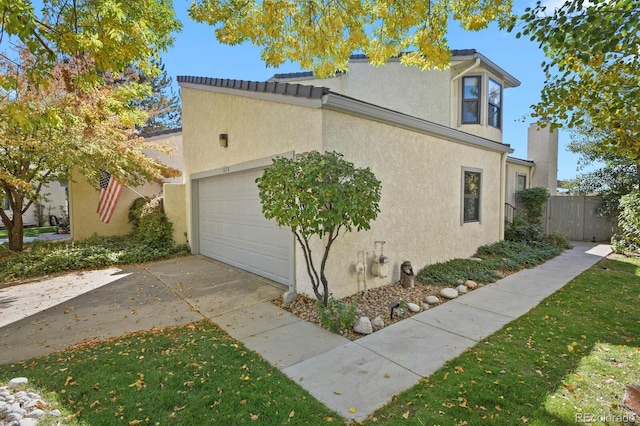 view of property exterior with a garage