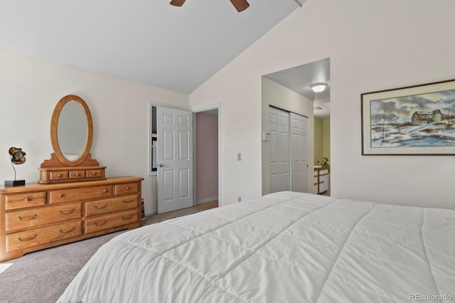 bedroom with ceiling fan, vaulted ceiling, carpet floors, and a closet