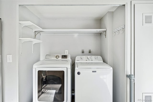 laundry room featuring washer and clothes dryer