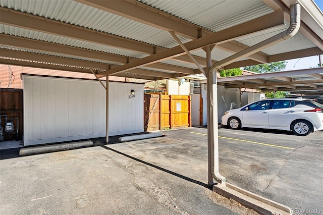 view of parking / parking lot with a carport