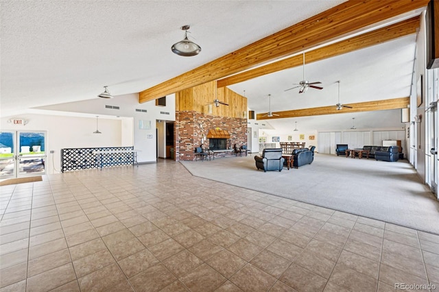 interior space featuring ceiling fan, beam ceiling, light carpet, high vaulted ceiling, and a textured ceiling