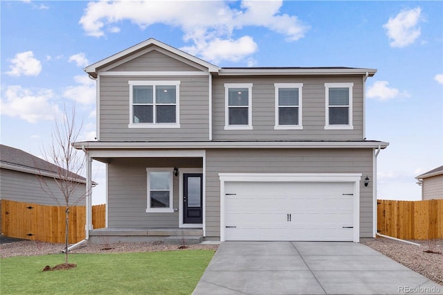 traditional home with a garage, a front lawn, driveway, and fence