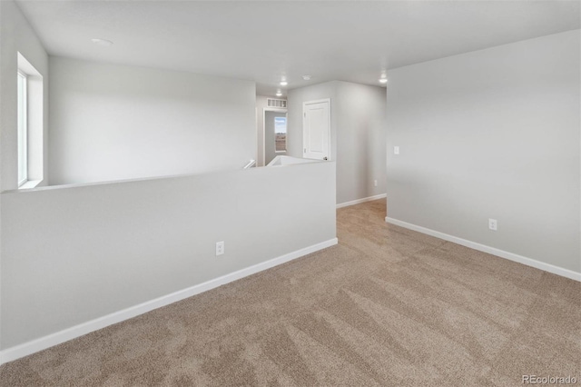 carpeted empty room with recessed lighting and baseboards